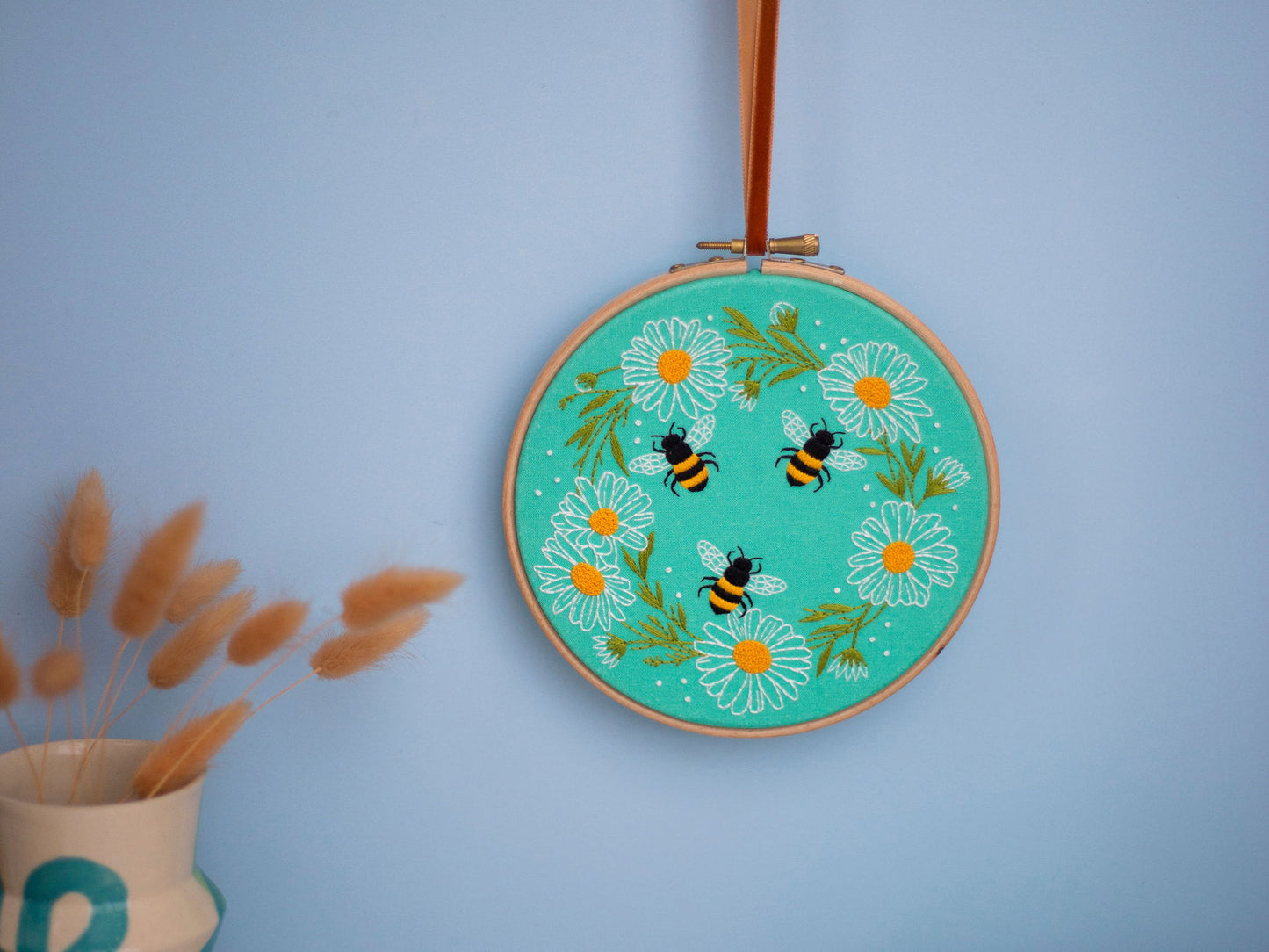 Daisy Chain and Bees Embroidery Hoop Kit on display