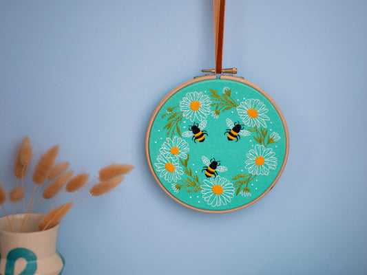 Daisy Chain and Bees Embroidery Hoop Kit on display